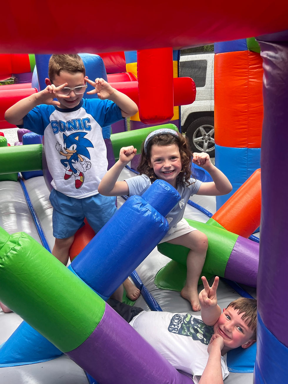 Children playing on an inflatable obstacle course from Jungle Rentals in Englewood, Tennessee