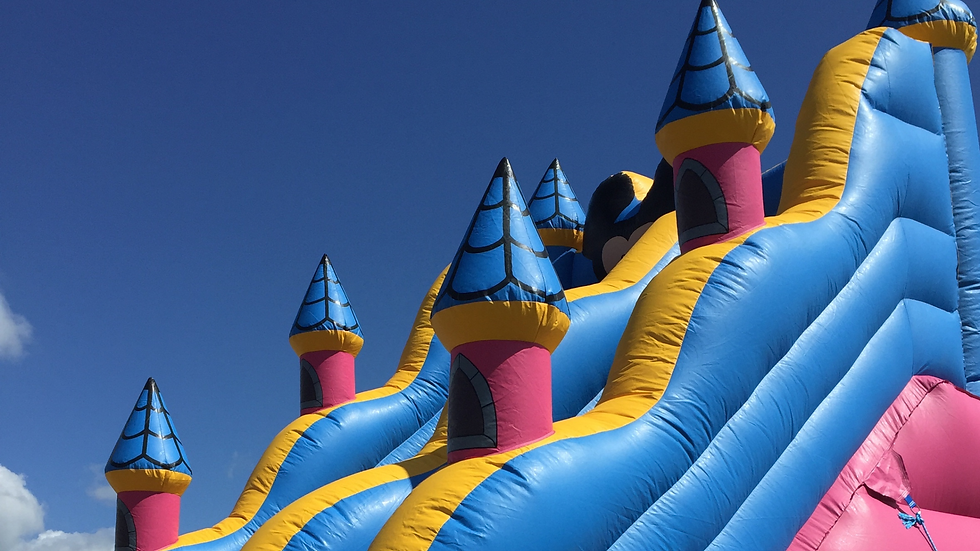 Colorful inflatable water slide and bounce house combo rental